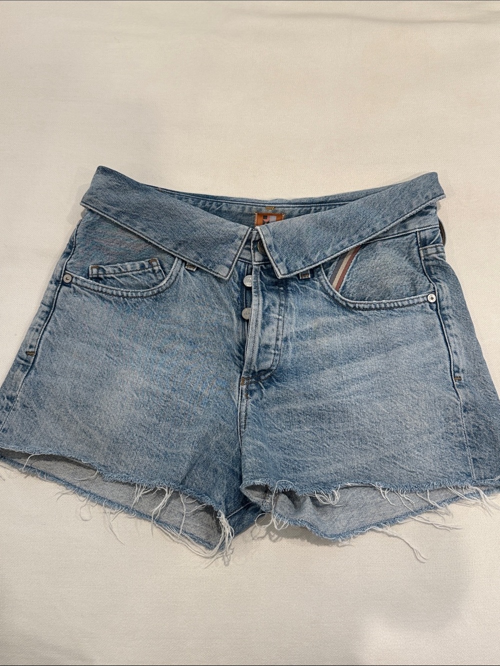 High-Rise Light Wash Denim Shorts with Distressed Hem